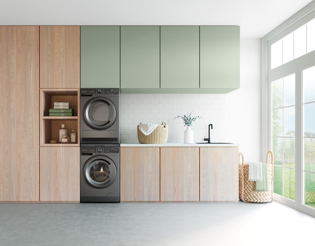 A laundry room with a Westinghouse washing machine and cabinets